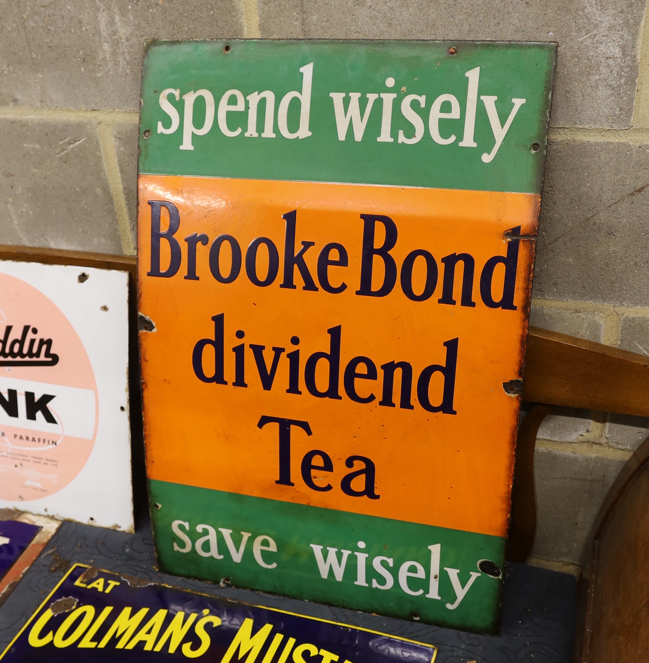 An original enamel advertising sign 'Spend Wisely/Save Wisely, Brooke Bond dividend Tea', width 51cm, height 75cm